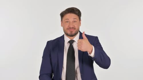 Man in Suit Gives Thumbs Up