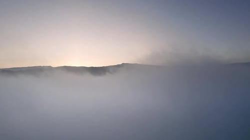 Sunrise over the clouds and the great landscape of the mountains.