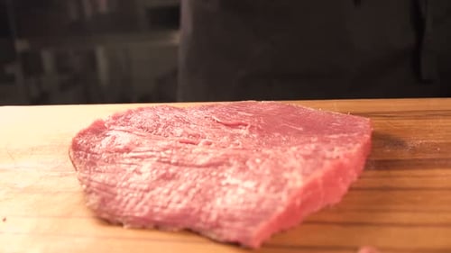Fresh Raw Meat on the Table, the Cook Beats Meat. the Chef