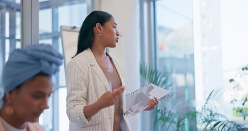 Woman Leading Team Presentation in Modern Office