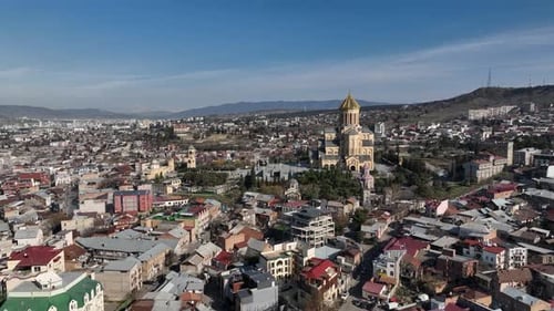Aerial view of Holy Trinity Cathedral Sameba in Tbilisi Georgia. Sunrise drone footage.