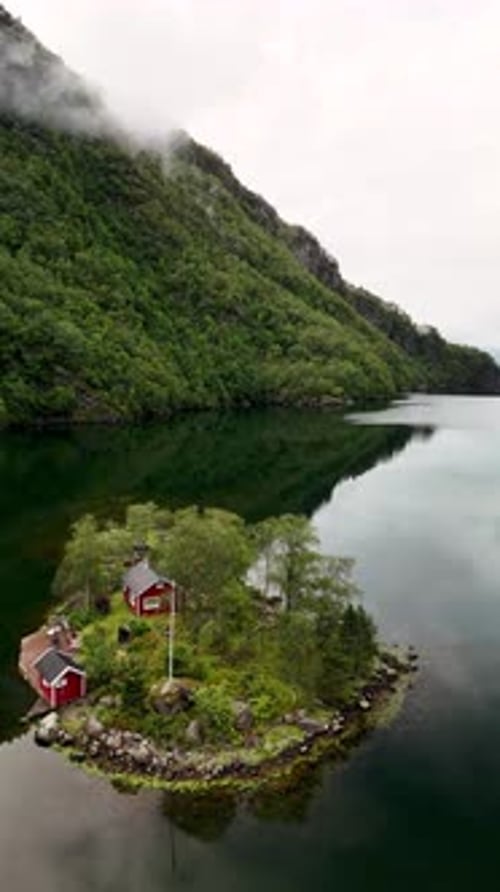 Majestic Fjord Landscape with Traditional Red Cabins in Norways Serene Wilderness