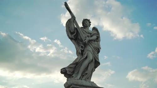 Angel statue outside of Castel Sant'Angelo in Rome. Clouds in background.