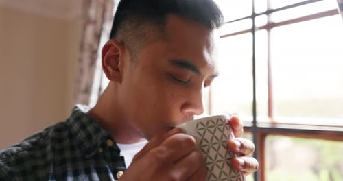 Man Enjoying Morning Coffee Near Window