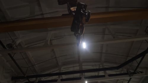 Industrial Crane Hook Slowly Moving Along the Ceiling