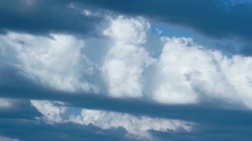 Time-Lapse of Fluffy Clouds Against Blue Sky