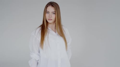Beautiful Blonde Woman Posing in White Shirt