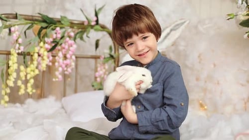 Happy Child Hugging White Bunny Rabbit Pet