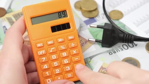 Calculator Sums Up Costs Over Euros and Socket