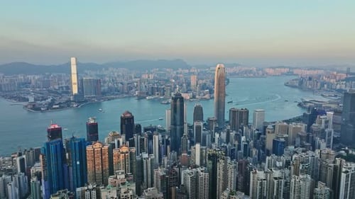 An aerial view of a large city and a body of water
