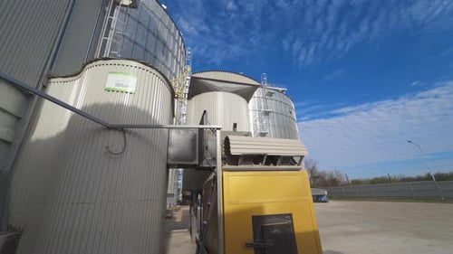 Metal grain elevator in agricultural zone. Grain warehouse