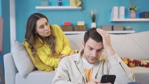Young Couple Arguing in Living Room