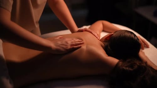 Woman Receiving Relaxing Massage at Spa