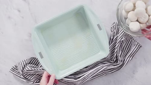 Preparing Baking Dish with Dough Balls for Baking