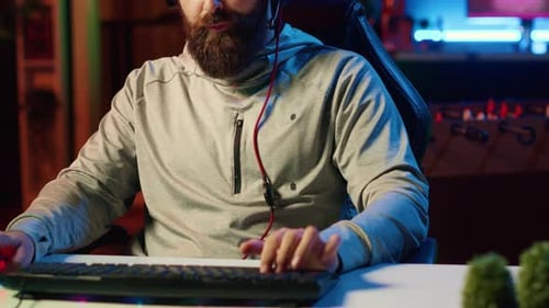 Close Up Shot of Pro Gamer Broadcasting Game on Internet Talking with Audience