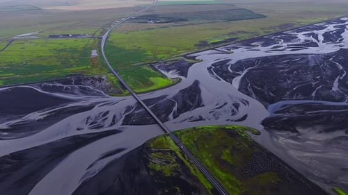 Aerial Road and Bridge Over Braided Glacial River South Iceland