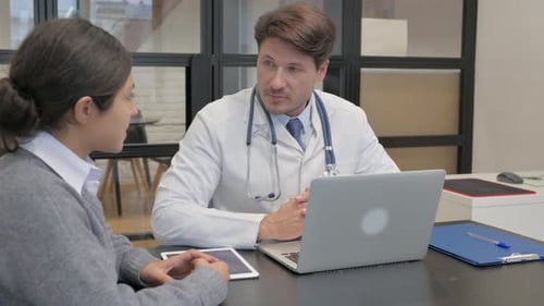 Doctor and Patient Discussing Health in Bright Office