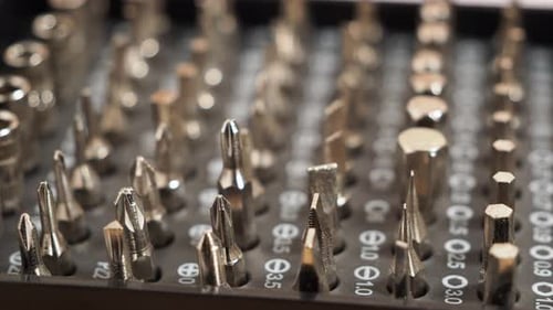 Rotating Universal screwdriver set with different bits. Close-up bit set.