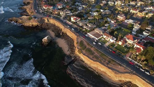 Aerial View of Sunset Cliffs, Upscale San Diego Neighborhood on Golden Hour Sun. Traffic on Boulevar