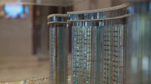 Layout of city streets, skyscrapers, and buildings. Layout of the Alamein city in miniature Arc shot