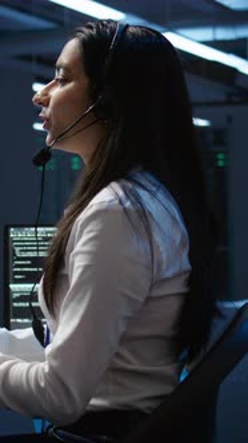 Vertical Video Worker in Server Farm Establishment Oversees Infrastructure Systems