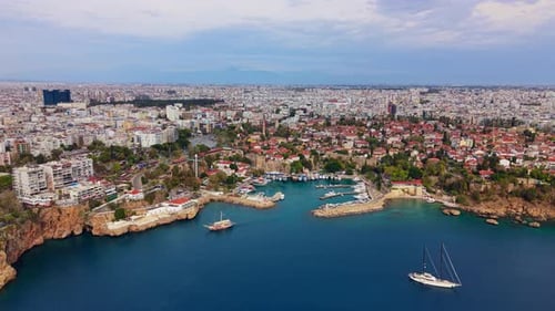 Aerial View of Historic Marina and Coastal City With Vessels Moored