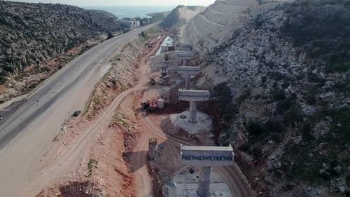 Bridge Being Constructed Next to Motorway