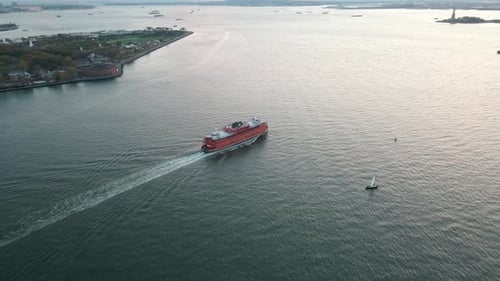 upper bayGovernors Island Picnic Point water transport ship in sunset orange golden hours