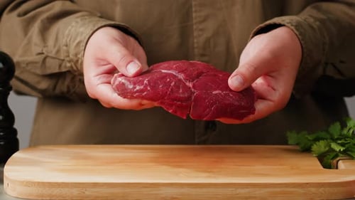 Man Chef Cooking Beef Steak Angus Closeup Professional Cheif Preparing Meat in Restaurant Kitchen
