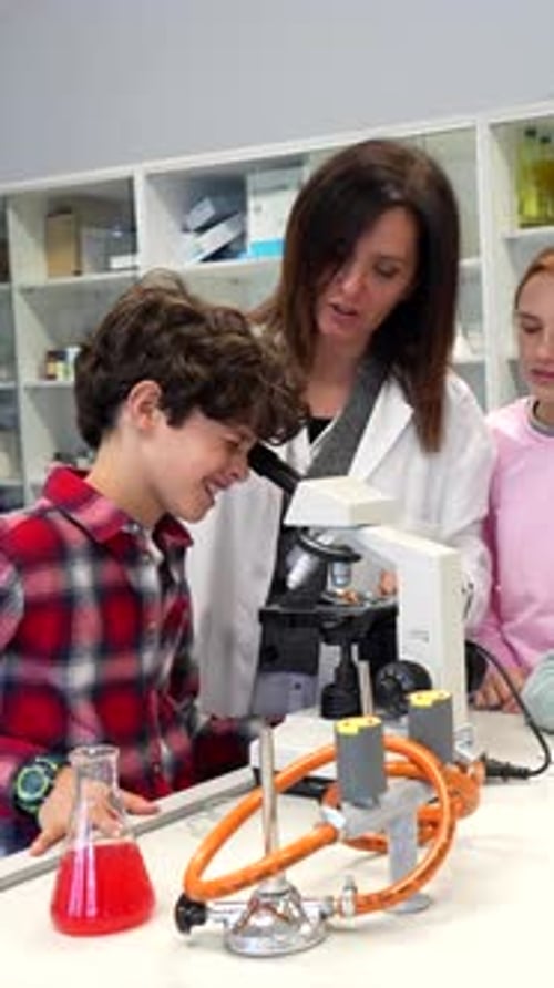 Students and teacher exploring science in the school laboratory