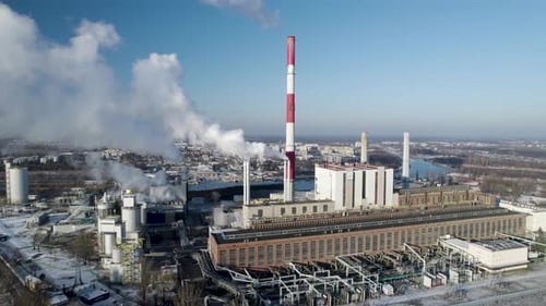 Drone approach shot of a large coal-fired thermal power plant complex in Poland.