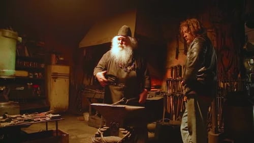 Skilled Craftsmen in the Workshop Featuring a Blacksmith and Their Dedicated Apprentice Stock Clip