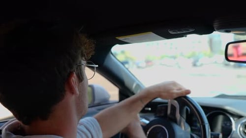 Adult Driving a Car on City Streets