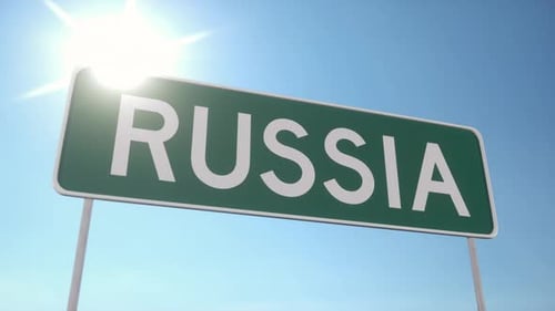 Green Road Sign With Russia Text Under Bright Summer Sunlight