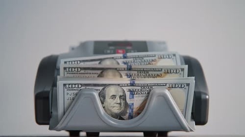 Electronic Counter Calculating Hundred Dollar Banknotes Closeup Money Counting