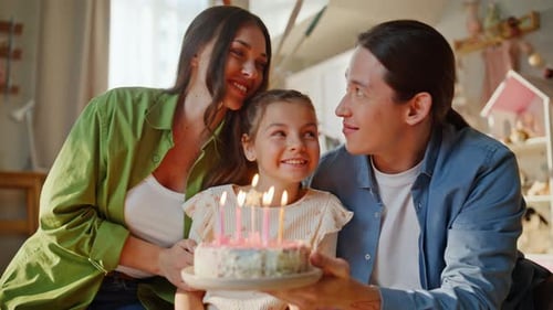 Happy family celebrating a child's birthday at home