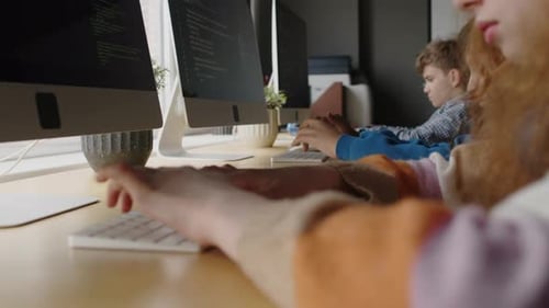 Hands of Kids Writing Programming Scripts at Coding School