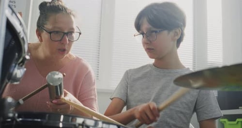 Teen Drum Lesson with Instructor in Music Room
