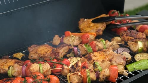 Barbecue Meat and Vegetables are Fried on the Grill Selective Focus
