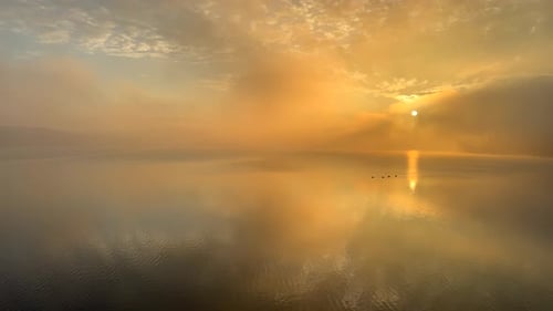 A Beautiful Sunset Reflected in the Calm Surface of the Lake