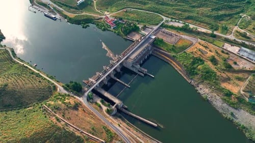 Hydroelectric power plant overview with dam and water flow