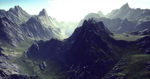 Majestic Mountains Rise Above a Serene Valley Bathed in Soft Sunlight