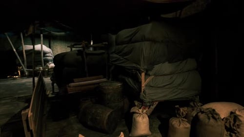 Dark Abandoned Cargo Hold with Grain Sacks and Barrels