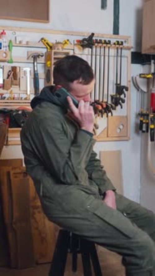 Carpenter Owner of Carpentry Shop is Lazing Around Due to Lack of Work Calling Friends and Taking