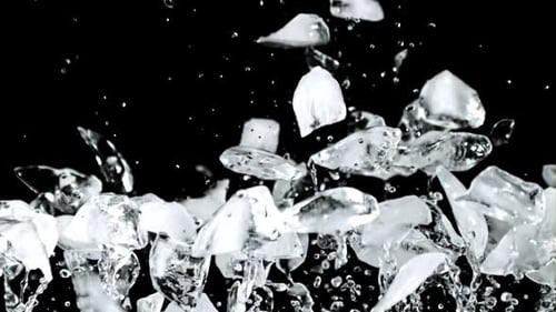 Super Slow Motion Pieces of Ice Rise Up and Fall Down