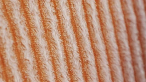 Close View of Textured Orange and White Striped Fabric Great for Sewing and Fashion Design Projects