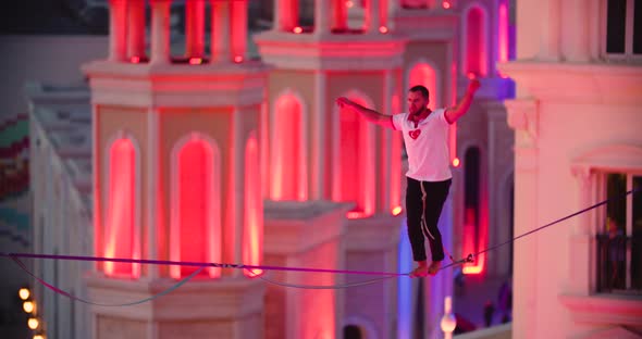Man Loses Balance and Falls Off the Slackline Hanging on Safety Line ...