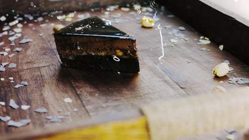 Rich Chocolate Cake with Pistachios on Wooden Tray