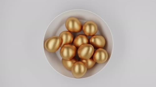 Shiny Golden Eggs Falling into White Bowl Animation