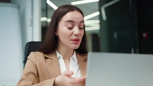 Businesswoman Video Conferencing in Modern Office